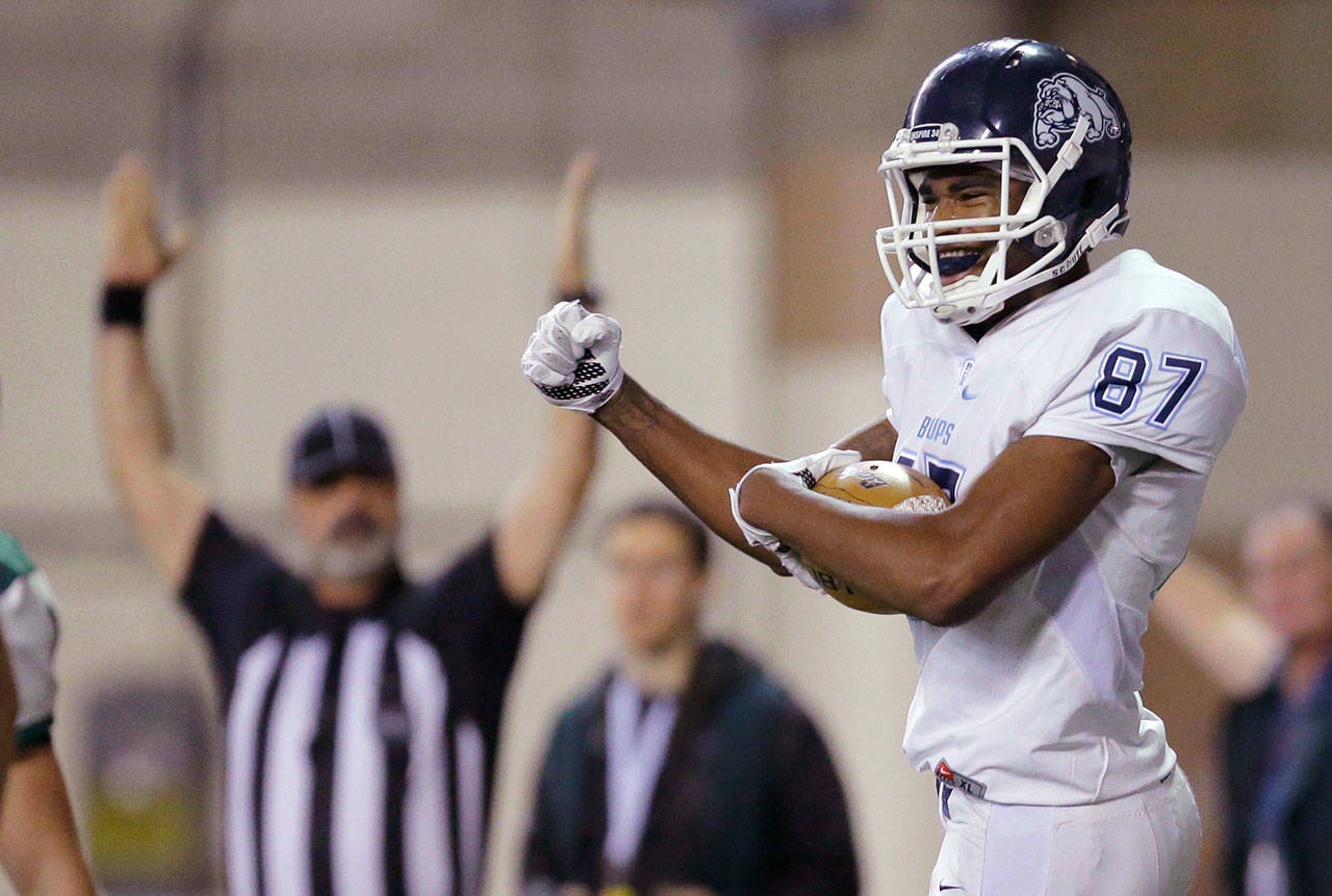 Gonzaga Prep’s Devin Culp (right) celebrates after he scored a touchdown against Skyline during the first half of the Class 4A state championship game in 2015. Culp signed a letter of intent with the University of Washington on Wednesday. (AP Photo/Ted S. Warren)