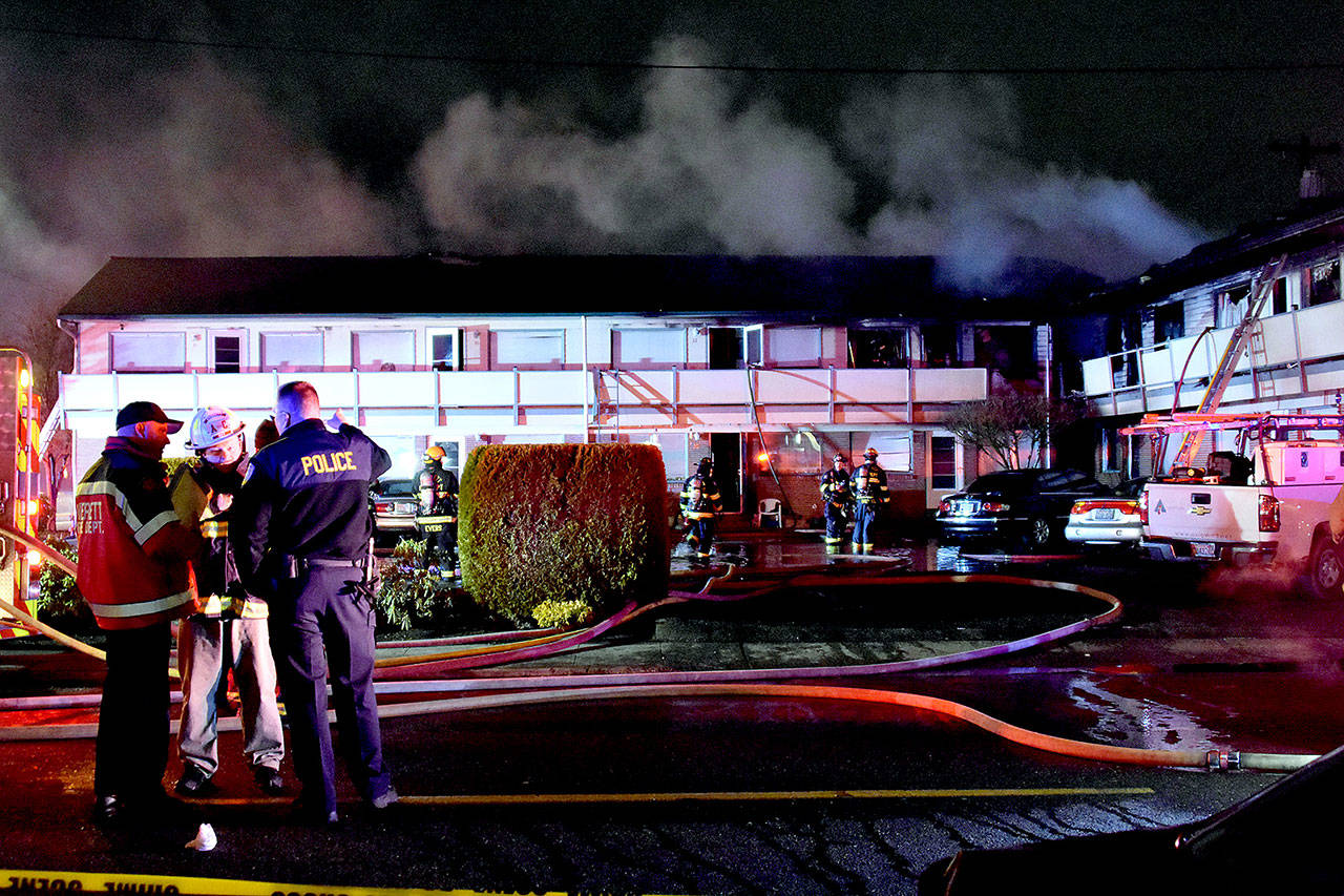 Many of the residents at Colby Square Apartments in Everett are elderly, neighbors said. One helped rescue an elderly woman in a wheelchair from the first floor. (Caleb Hutton / The Herald)