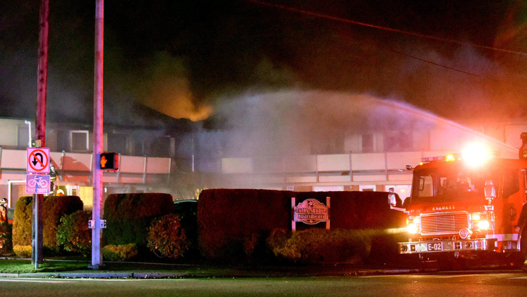 Many of the residents at Colby Square Apartments in Everett are elderly, neighbors said. One helped rescue an elderly woman in a wheelchair from the first floor. (Caleb Hutton / The Herald)
