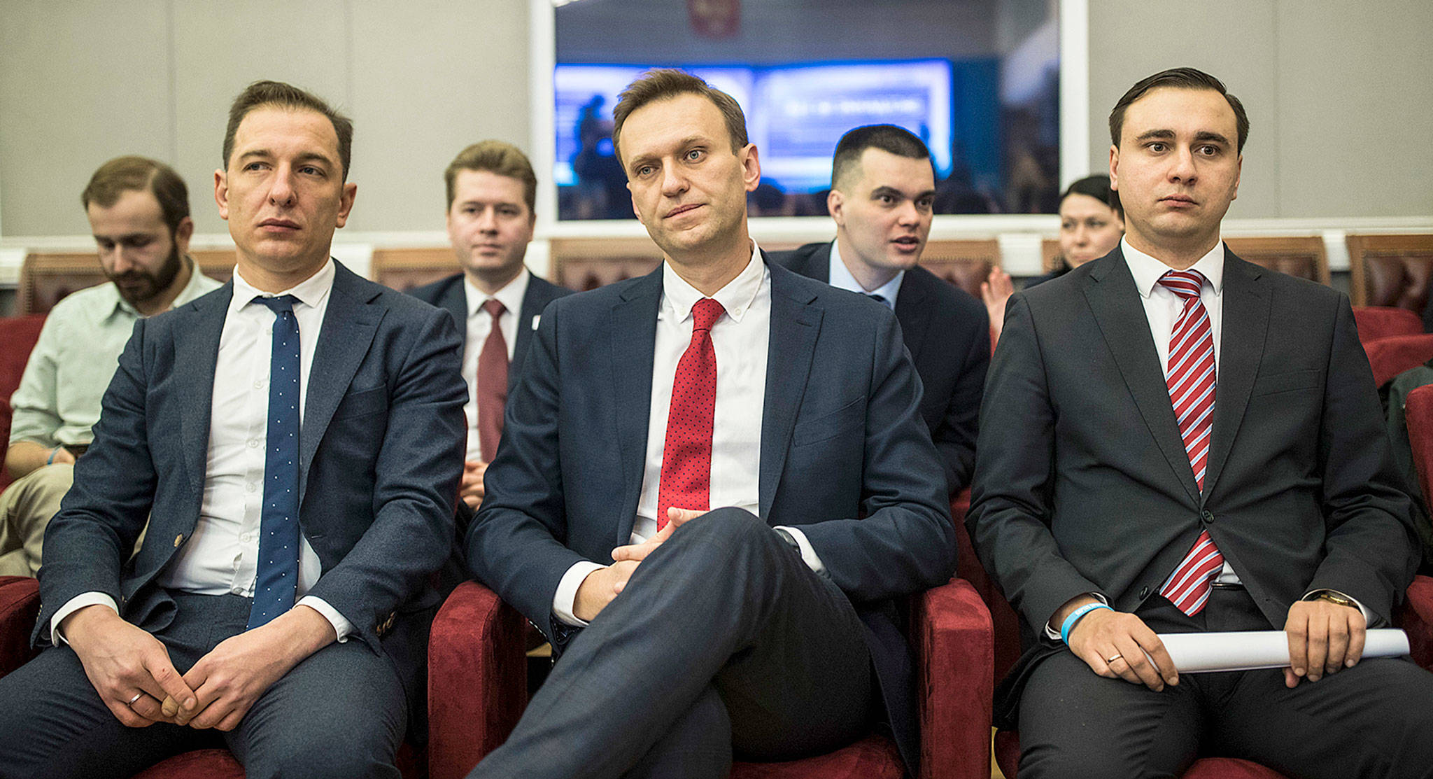 Russian opposition leader Alexei Navalny (center), who submitted endorsement papers necessary for his registration as a presidential candidate, sits at the Central Election Commission in Moscow on Monday, awaiting a ruling whether to run for president. (Evgeny Feldman/Navalny Campaign via AP)