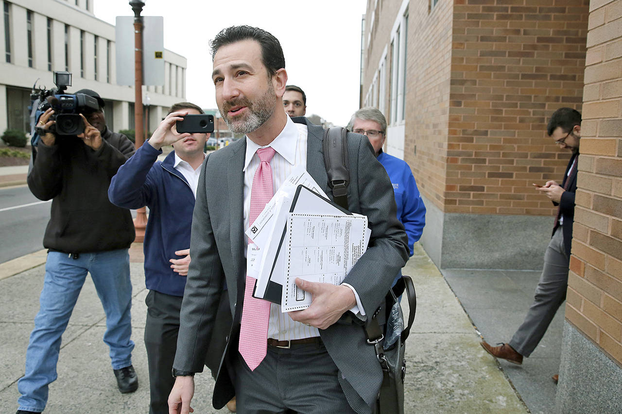 Ezra Reese, a lawyer representing Shelly Simonds, walks outside the courthouse in Newport News, Virginia on Dec. 20. (Jonathon Gruenke/The Daily Press via AP)