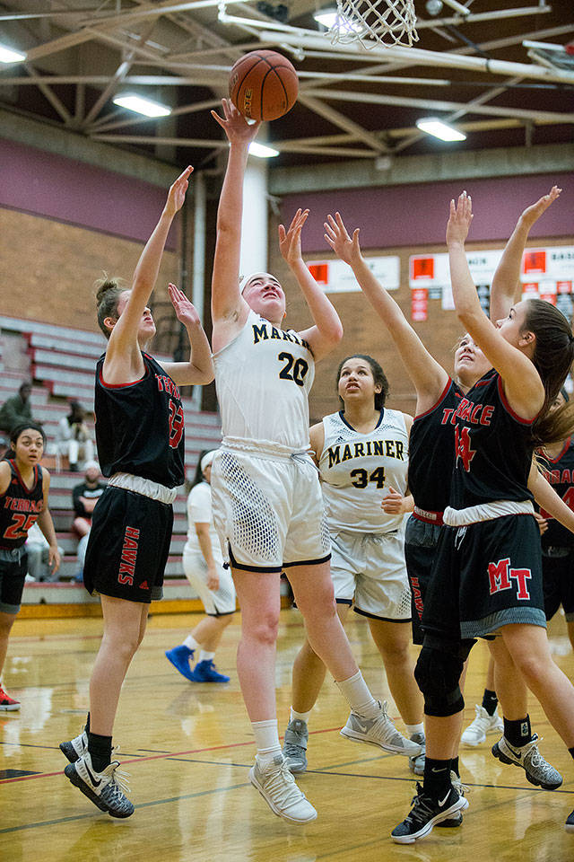 Mariner’s Taliyah Clark takes a shot while maneuvering around three Mountlake Terrace defenders during the Marauders’ 74-44 victory over Mountlake Terrace in the first game of the Mountlake Terrace Holiday Tournament on Tuesday. (Andy Bronson / The Herald)