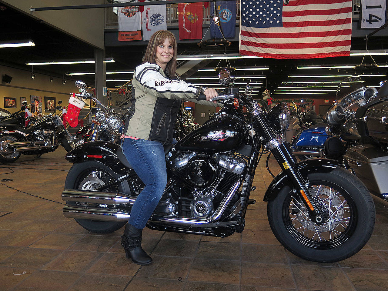 Terri Meehan sits on a 2018 Harley Softail Slim in Milwaukee’s House of Harley on Dec. 12. Meehan took a riding course at the dealership. (AP Photo/Ivan Moreno)