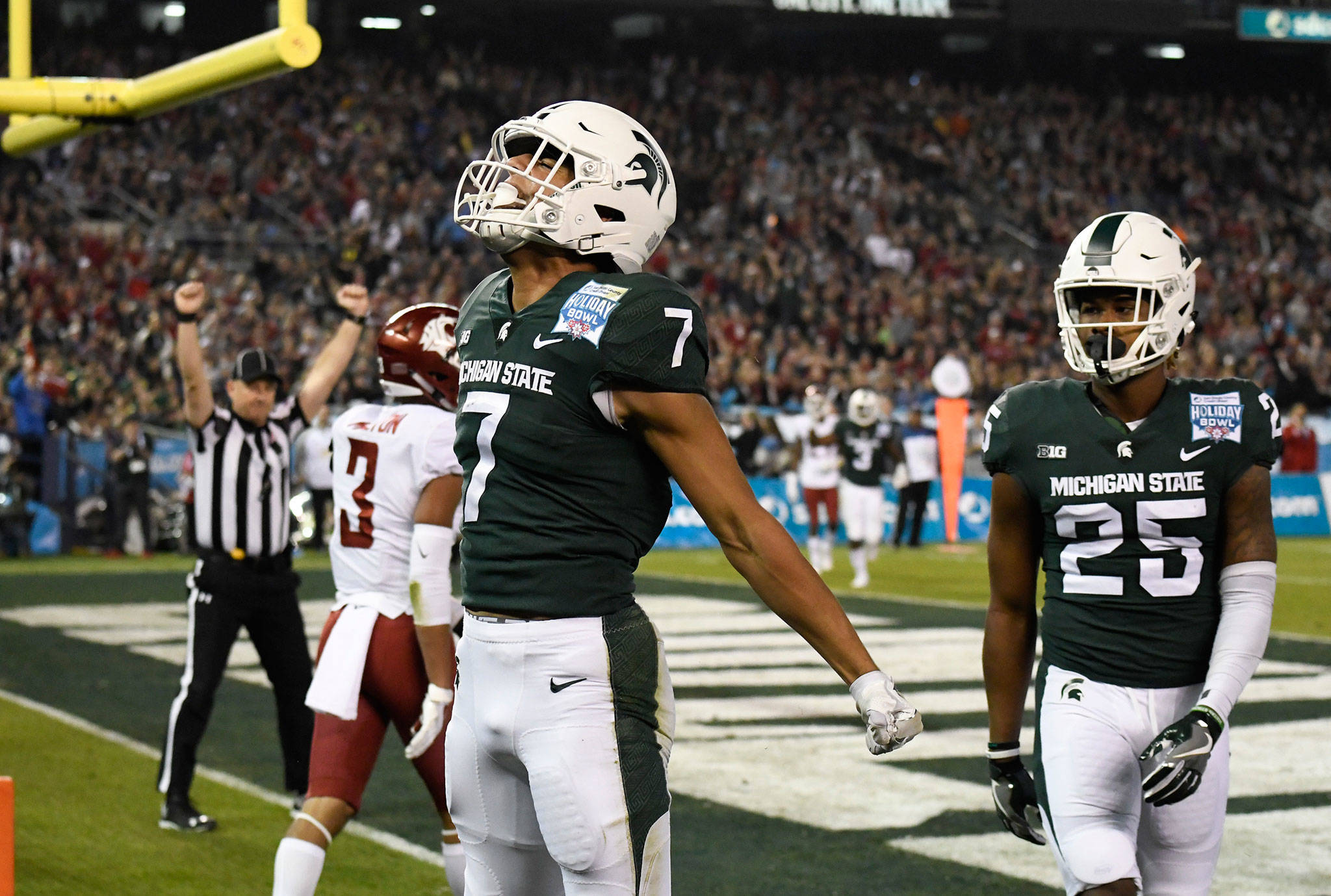 Michigan State wide receiver Cody White (7) celebrates a touchdown catch against Washington State during the first half of the Holiday Bowl on Dec. 28, 2017, in San Diego. (AP Photo/Denis Poroy)