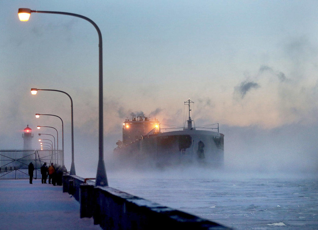 Steam rises from Lake Superior as the ship St. Clair comes to harbor during some of the coldest temps of the year Sunday at Canal Park in Duluth, Minnesota. The St. Clair is a self-unloader built in 1976 at Sturgeon Bay, Wisconsin, and is 770 feet long and has 26 hatches that open into 5 cargo holds, providing a load capacity of 45,000 tons. (David Joles / Star Tribune)
