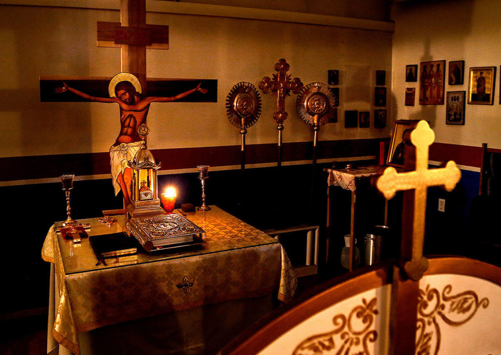 The altar at St. Thomas Orthodox Church in Snohomish faces east as it does in all Orthodox churches. The Rev. David Sommer, priest of St. Thomas, faces east, with his back to the congregation during the liturgy. (Dan Bates / The Herald)
