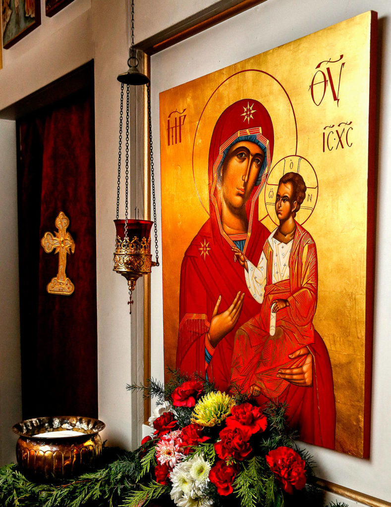 Despite a humble exterior location for a church, beautiful icons inside are a distinct feature of Orthodox churches, and are believed to be “windows to heaven.” This icon of Mary and the Christ child was painted using gold leaf and egg tempera by iconographer Heather Sommer, the wife of the Rev. David Sommer. (Dan Bates / The Herald)
