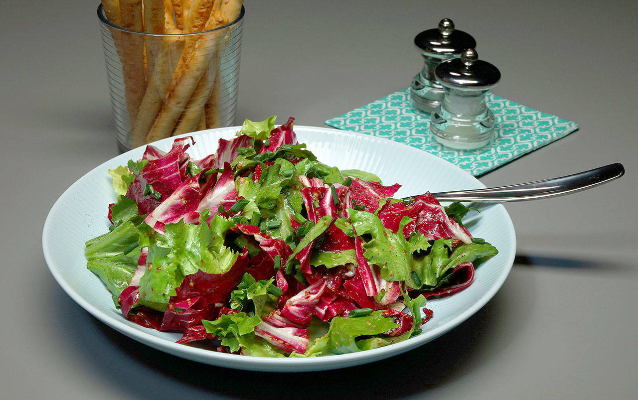 Honey and mustard flavor a sweet-tart vinaigrette that balances the bitter notes in the chicories. (Terrence Antonio James / Chicago Tribune)