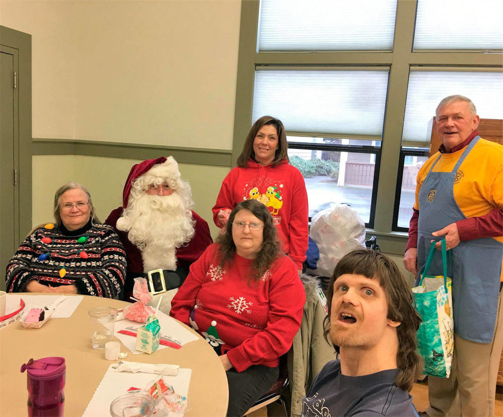 The Rotary Club of Arlington on Dec. 15 provided lunches and gifts for over 200 seniors at the Stillaguamish Senior Center. (Contributed photo)
