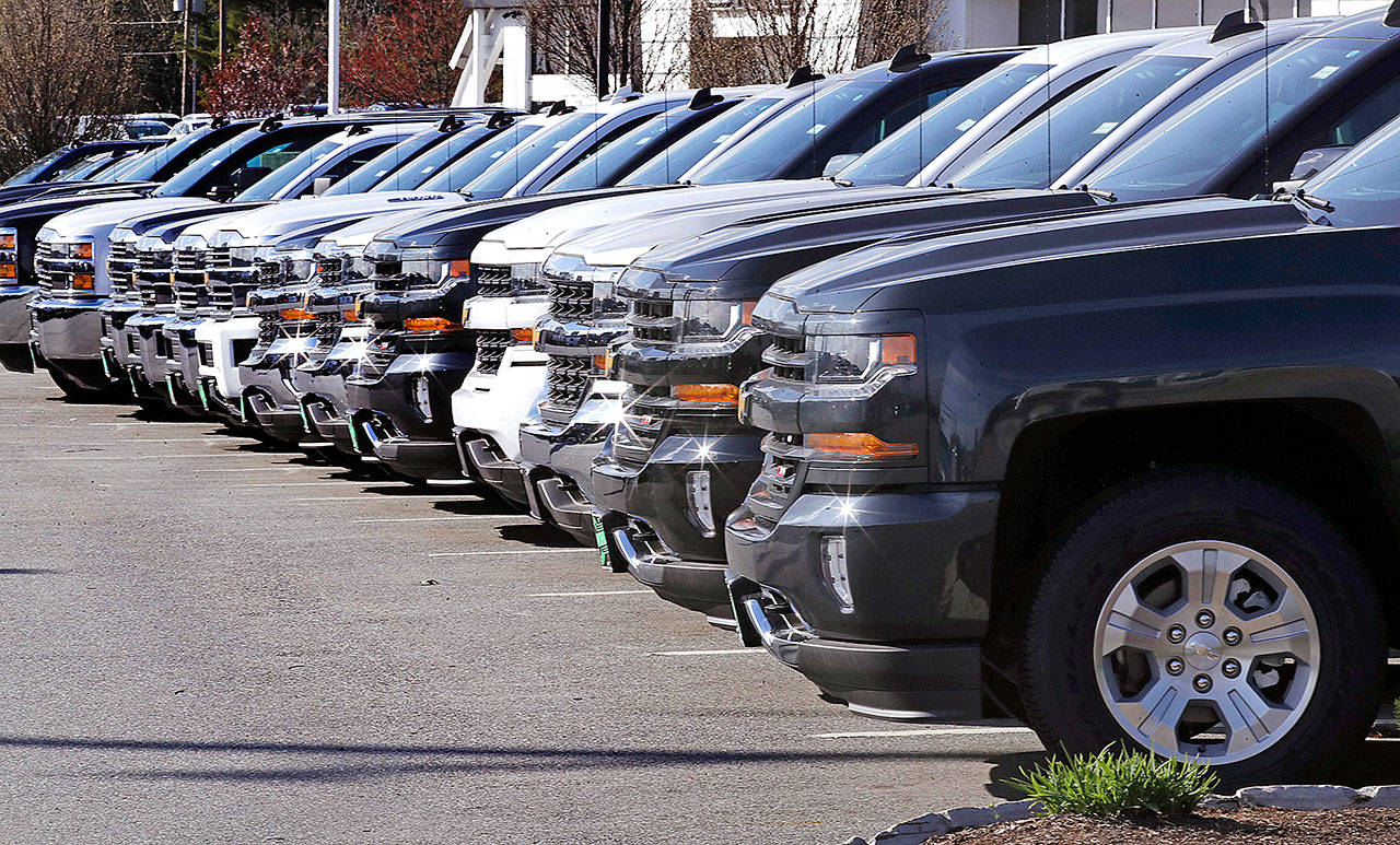 Chevrolet Silverado pickups are seen on display at Quirk Auto Dealers in Manchester, New Hampshire, in April. (AP Photo/Charles Krupa)