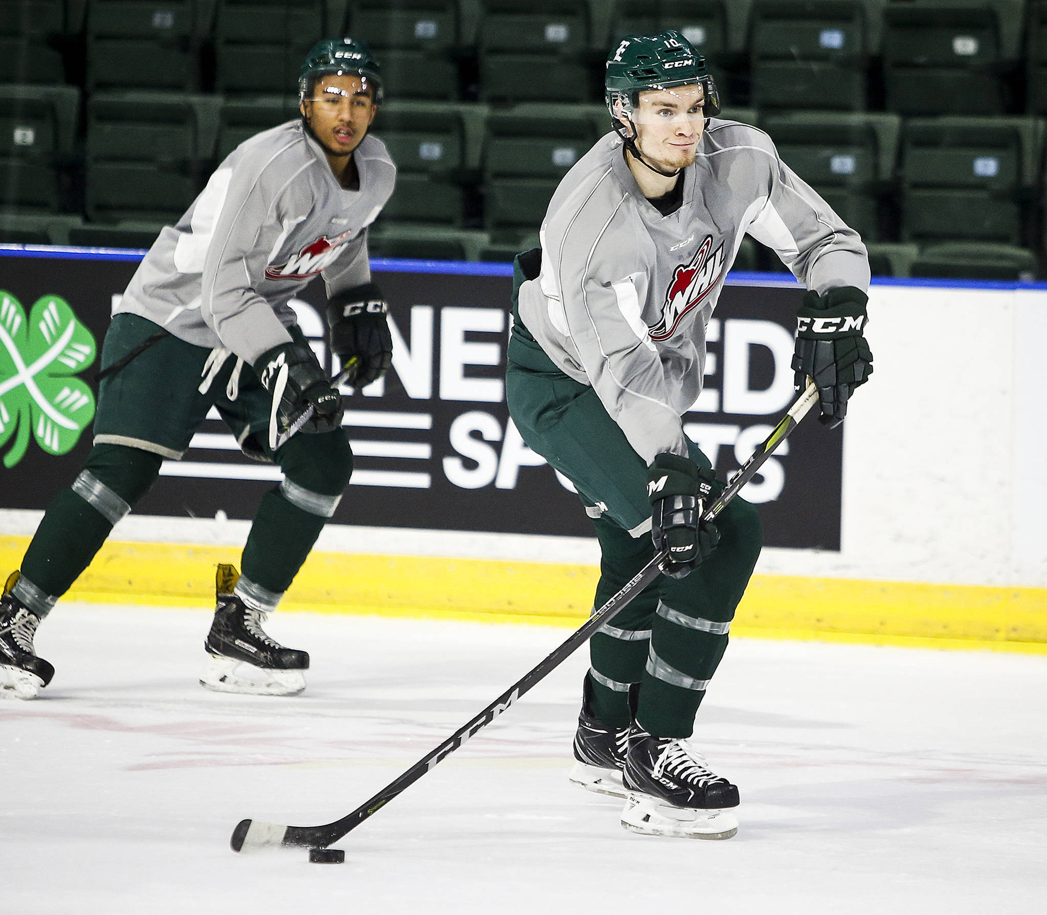 Newly acquired Silvertips center Ethan O’Rourke (right) skates at a team practice on Jan. 3, 2018, at Angel of the Winds Arena in Everett. (Ian Terry / The Herald)