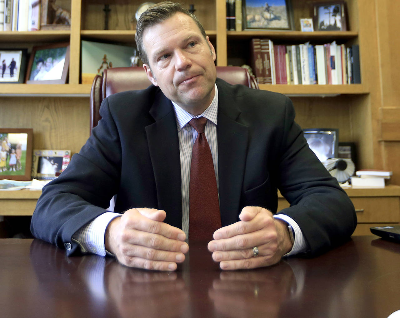 In this May 17 photo, Kansas Secretary of State Kris Kobach talks with a reporter in his office in Topeka, Kansas. Kobach, a conservative Republican, is President Trump’s voter fraud commission’s vice chairman. Trump dissolved the commission on Wednesday. (AP Photo/Orlin Wagner, File)