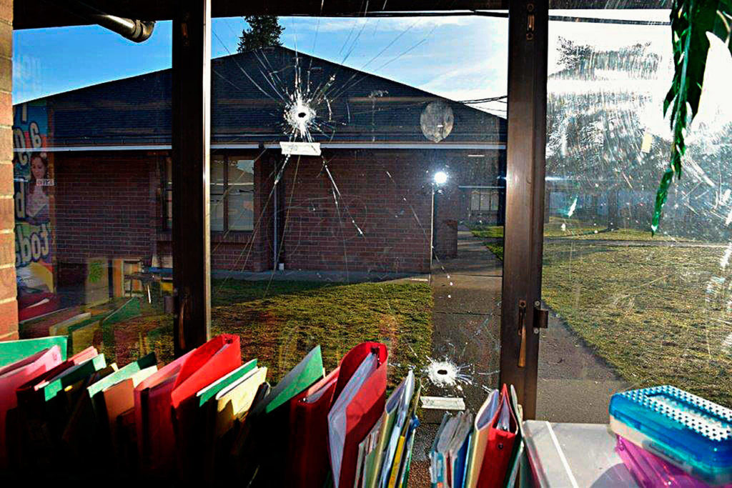 Some of the dozens of bullet holes in windows at Pinewood Elementary School in Marysville. (Marysville Police Department)
