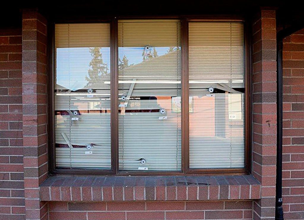 Some of the dozens of bullet holes in windows at Pinewood Elementary School in Marysville. (Marysville Police Department)
