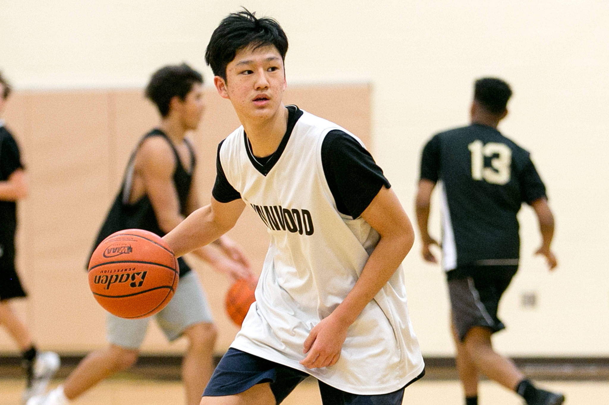 Anthony Joo runs a play during practice Thursday afternoon at Lynnwood High School in Lynnwod on January 4, 2018. (Kevin Clark / The Daily Herald)