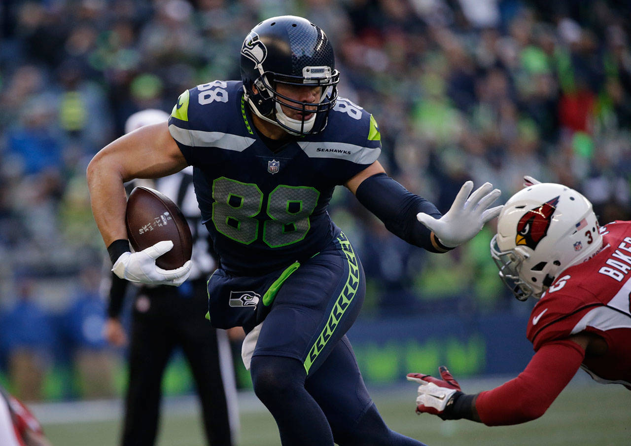 Seahawks tight end Jimmy Graham (88) runs with the ball after a reception against the Cardinals in the second half of a game Dec. 31, 2017, in Seattle. (AP Photo/John Froschauer)