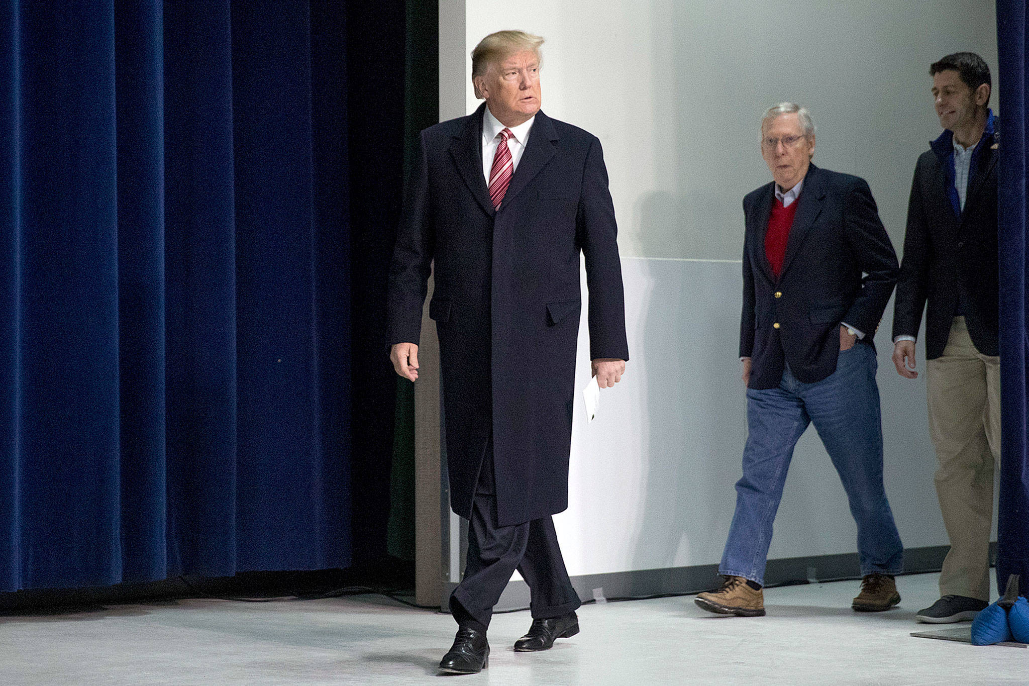 President Donald Trump (left), accompanied by Senate Majority Leader Mitch McConnell of Kentucky (second from right) and House Speaker Paul Ryan of Wisconsin, arrives for a news conference after participating in a Congressional Republican Leadership Retreat at Camp David, Maryland, on Saturday. (AP Photo/Andrew Harnik)