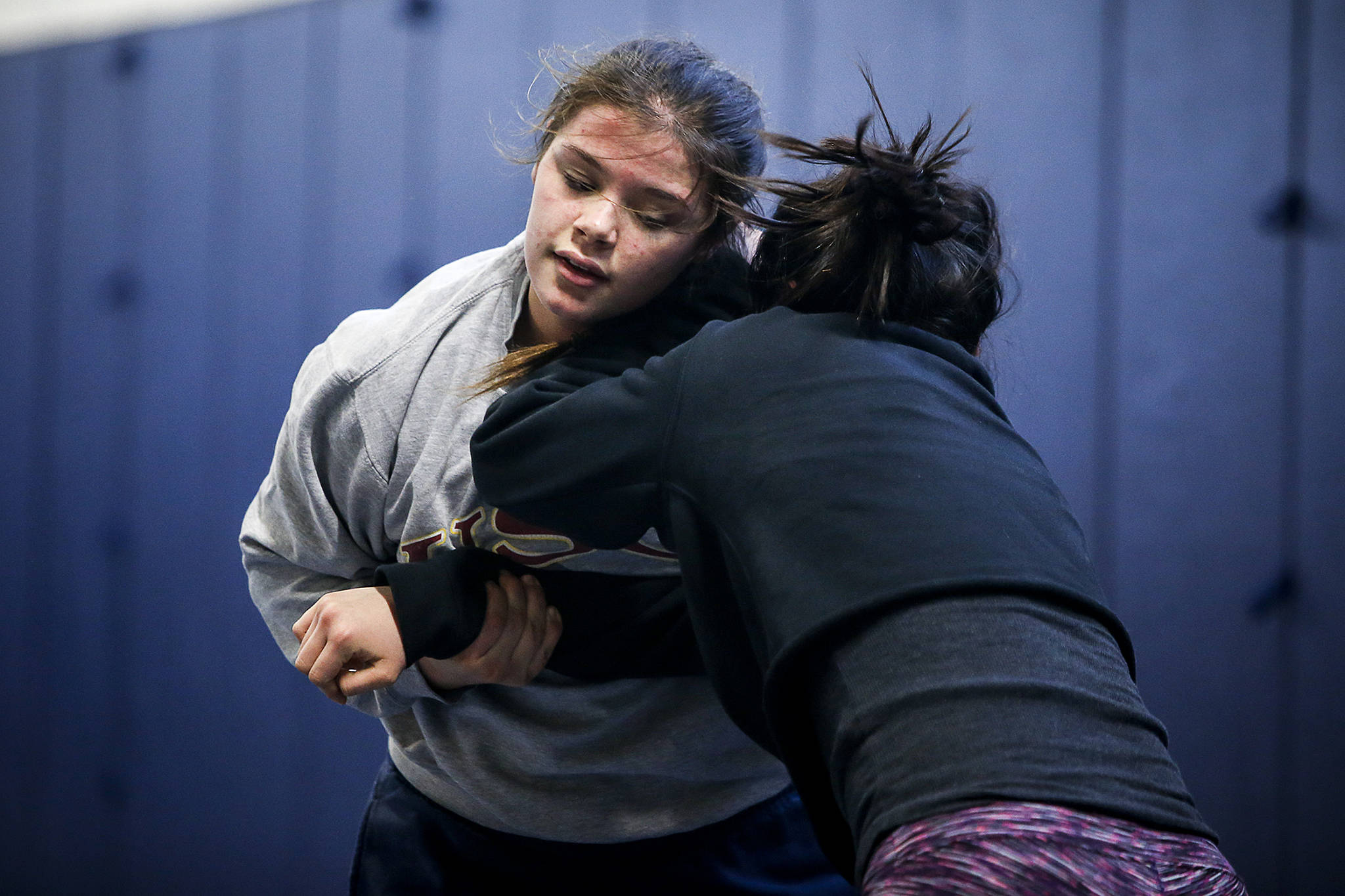 Glacier Peak wrestler Kiley Hubby (left) trains with teammate Cassy Vando on Jan. 4 in Snohomish. Hubby made an impression on college coaches by winning a tournament in California in mid-December. (Ian Terry / The Herald)