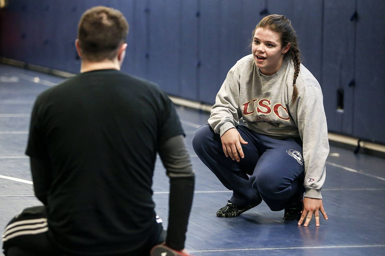 A high-school wrestler shows college coaches what she can do