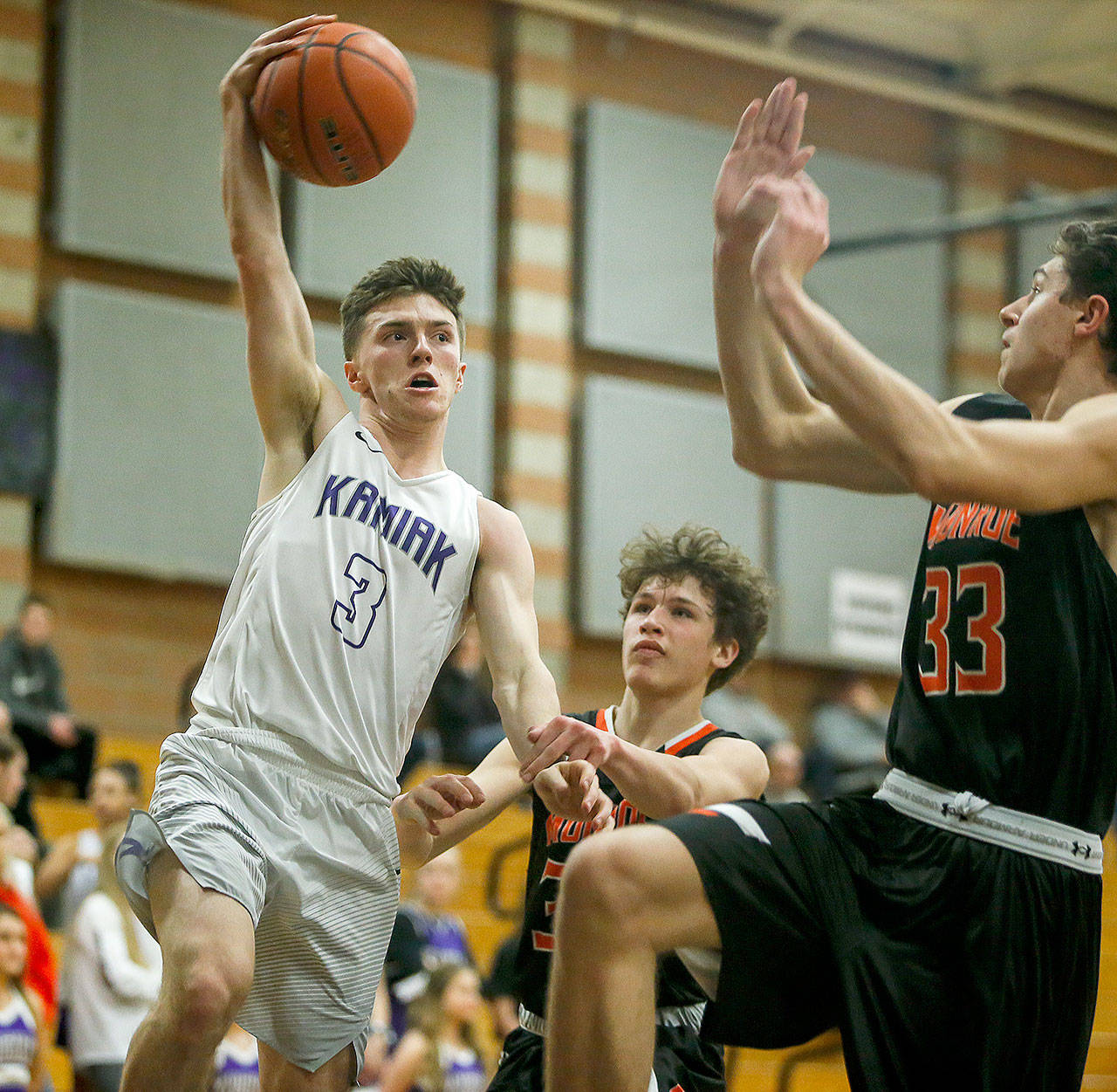 Kamiak’s Carson Tuttle (3) makes a quick pass during a game against Monroe on Jan. 2 at Kamiak High School in Mukilteo. Tuttle set the Kamiak school scoring record earlier this season with 52 points in a tournament in Southern California. (Ian Terry / The Herald)