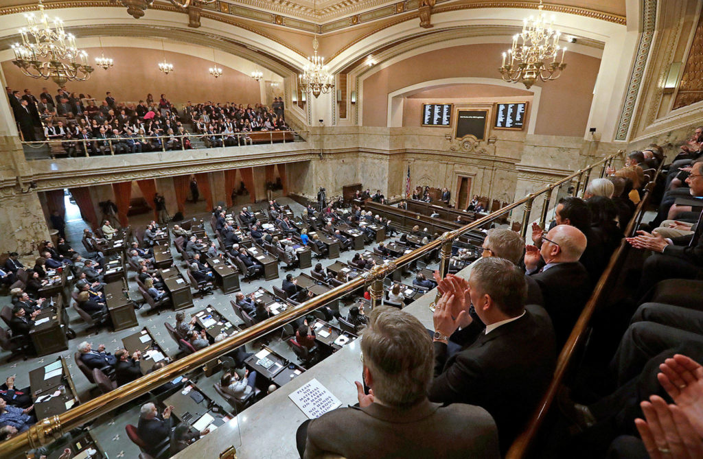 Viewers in the gallery applaud as Gov. Jay Inslee makes his annual state-of-the state address before a joint legislative session Tuesday in Olympia. (Elaine Thompson / Associated Press)
