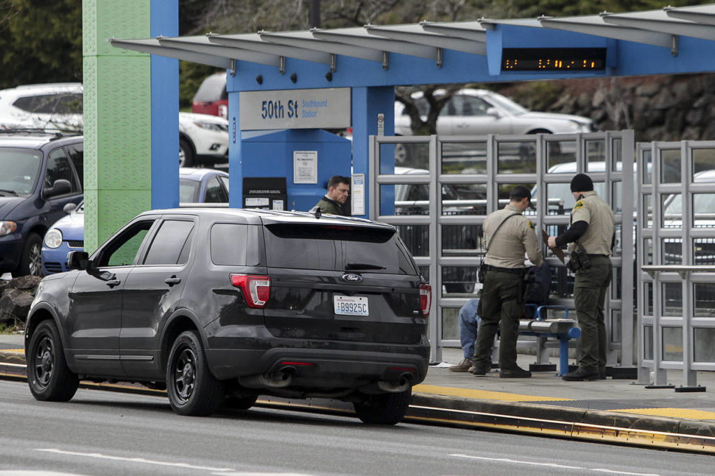 Snohomish County Sheriff’s deputies conduct fare enforcement for the Swift transit line on Evergreen Way in Everett on Wednesday. (Ian Terry / The Herald)
