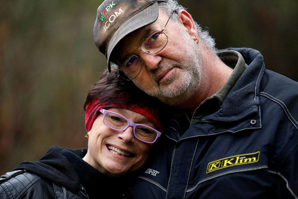Bruce Gutschmidt, 57, and his longtime girlfriend, Christine Messer, 56, feel they are put in a tough spot by the low valuation on Gutschmidt’s Bothell-area property by the Everett School District. The district is planning to build a new high school. (Dan Bates / The Herald)
