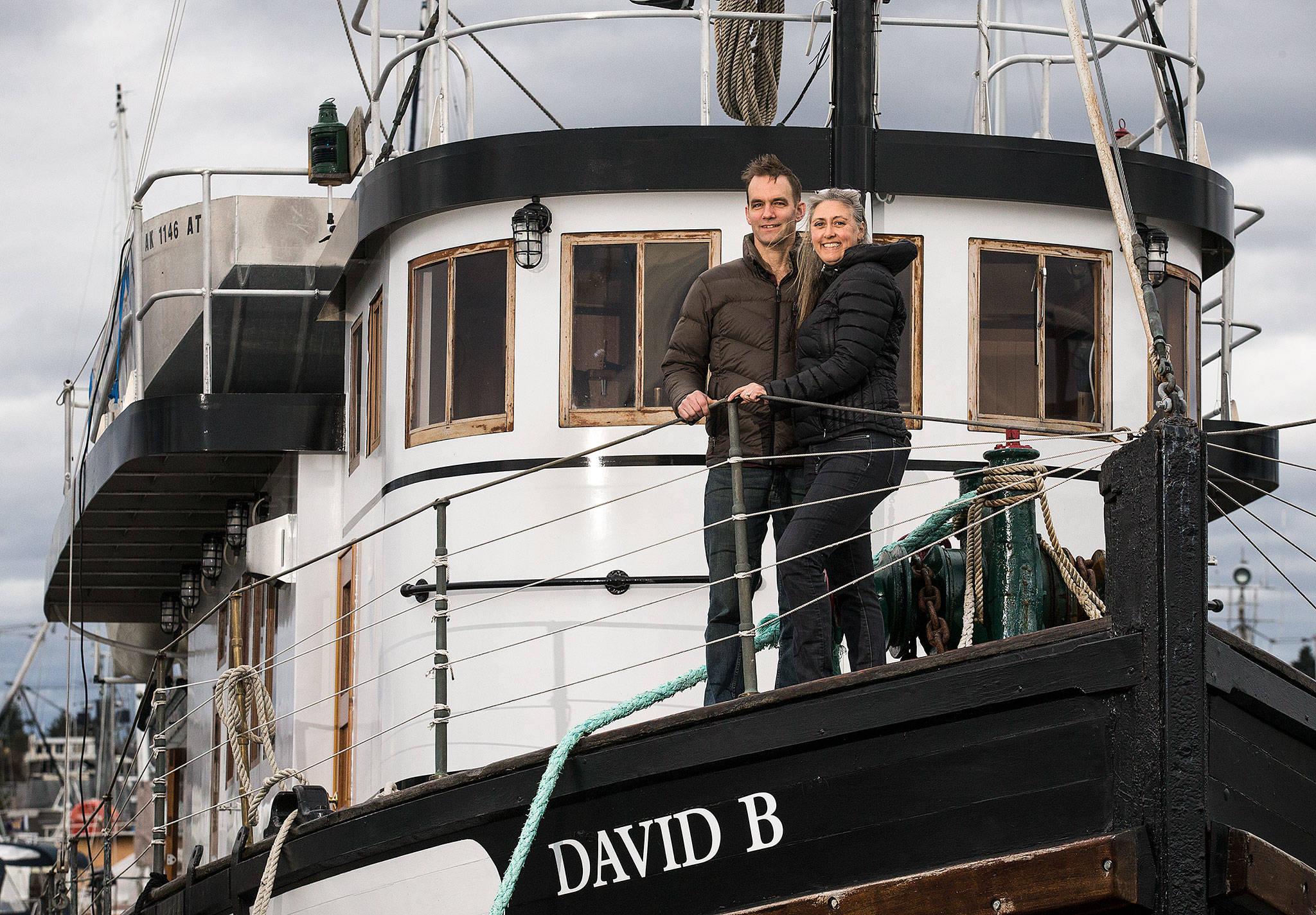 Jeffrey and Christine Smith stand on their ship, the David B. Motor Vessel, in Bellingham. The couple will be speaking about the 1929 ship they restored and now use for tours through southeast Alaska. (Andy Bronson / The Herald)