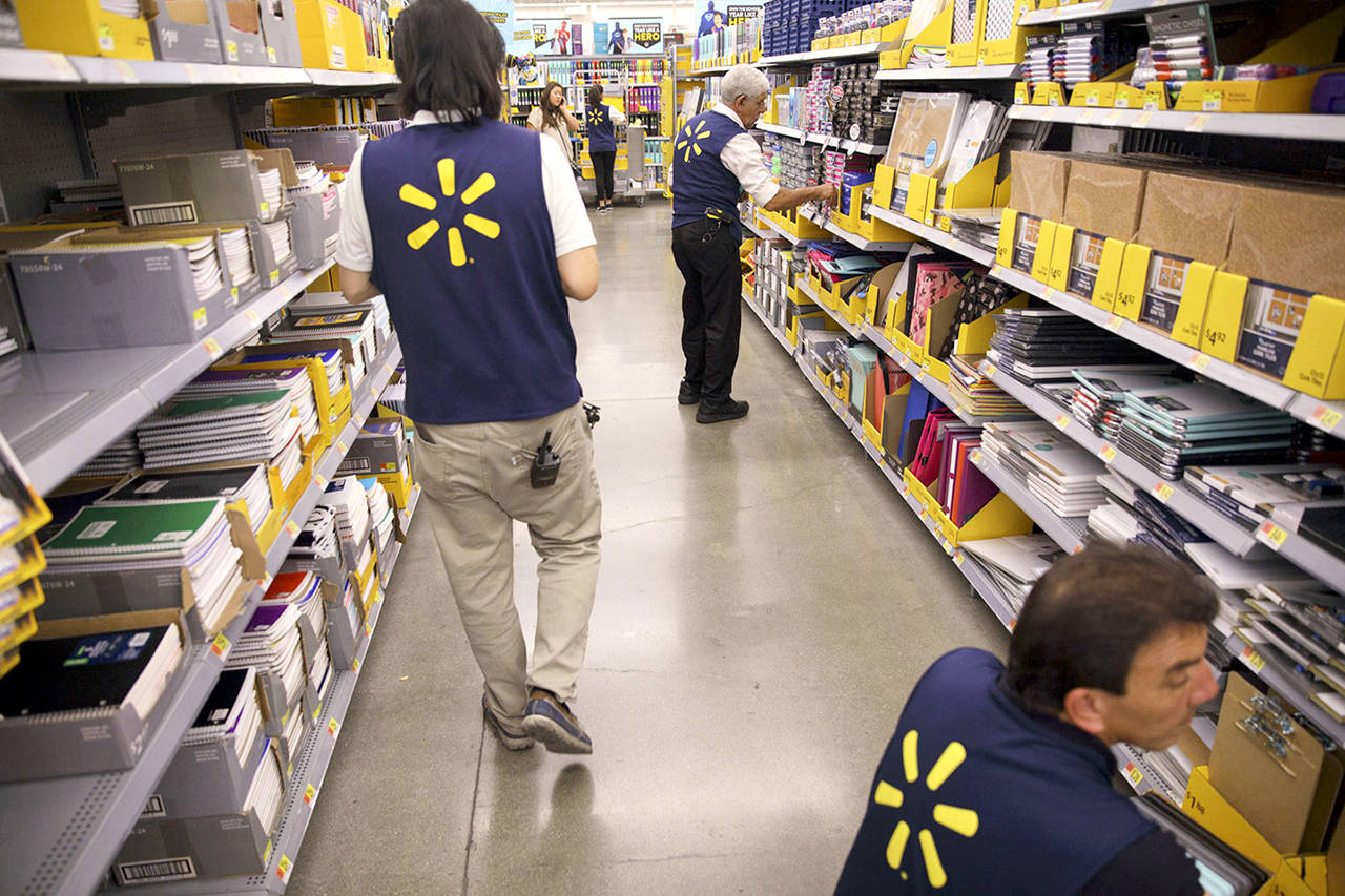 Employees restock shelves of school supplies at a Wal-Mart Stores Inc. location in Burbank, California, on Aug. 8, 2017. (Patrick T. Fallon / Bloomberg)