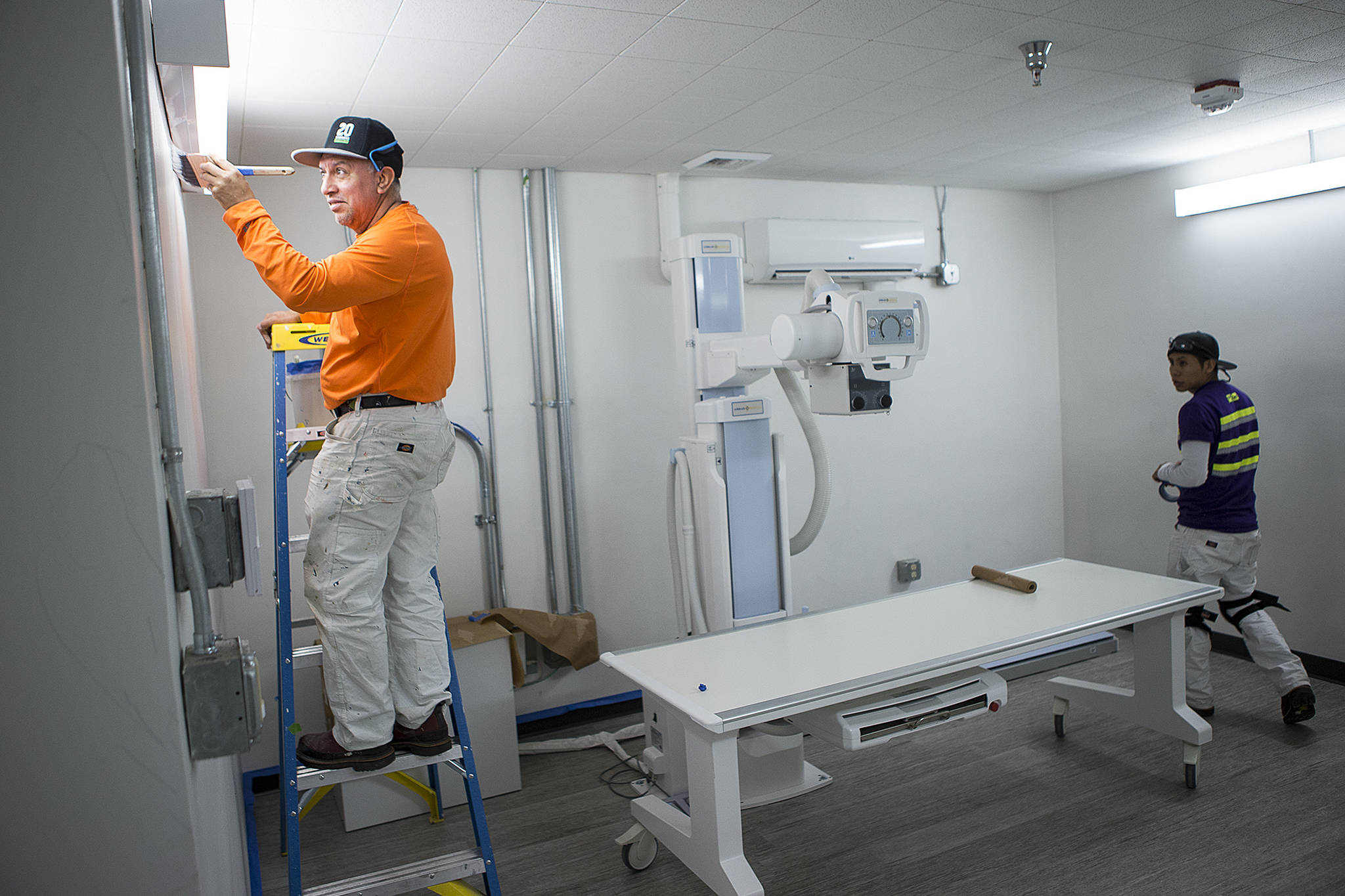 Workers put the final touches on the X-ray room of Community Health Center of Snohomish County’s newest clinic location on Rucker Avenue in Everett on Friday. (Ian Terry / The Herald)