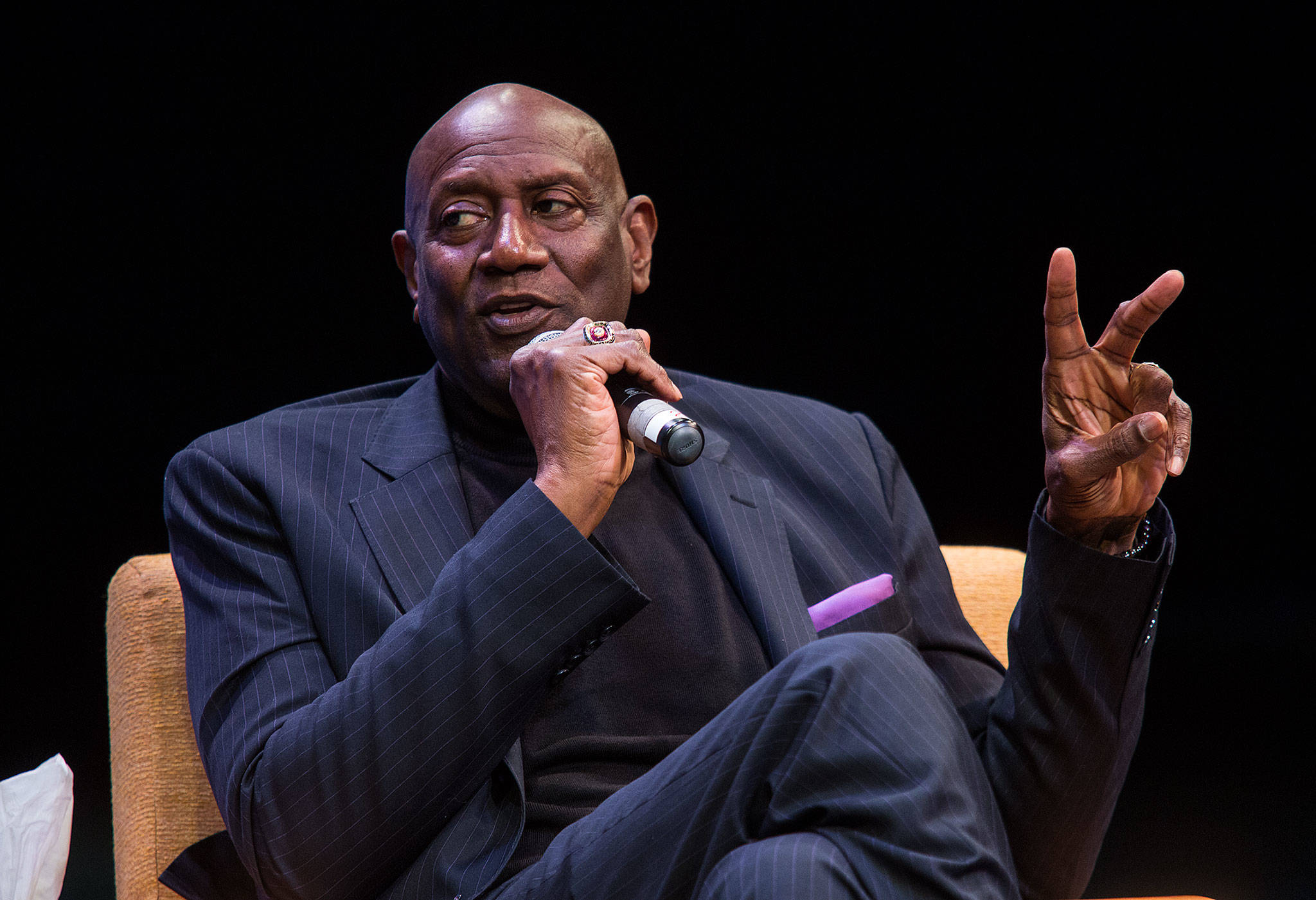 Former Seattle SuperSonic Spencer Haywood speaks about athletes and activism to an audience in the Black Box Theatre at Edmonds Community College as part of the school’s Martin Luther King celebration on Jan. 11, 2018, in Lynnwood. (Andy Bronson / The Herald)