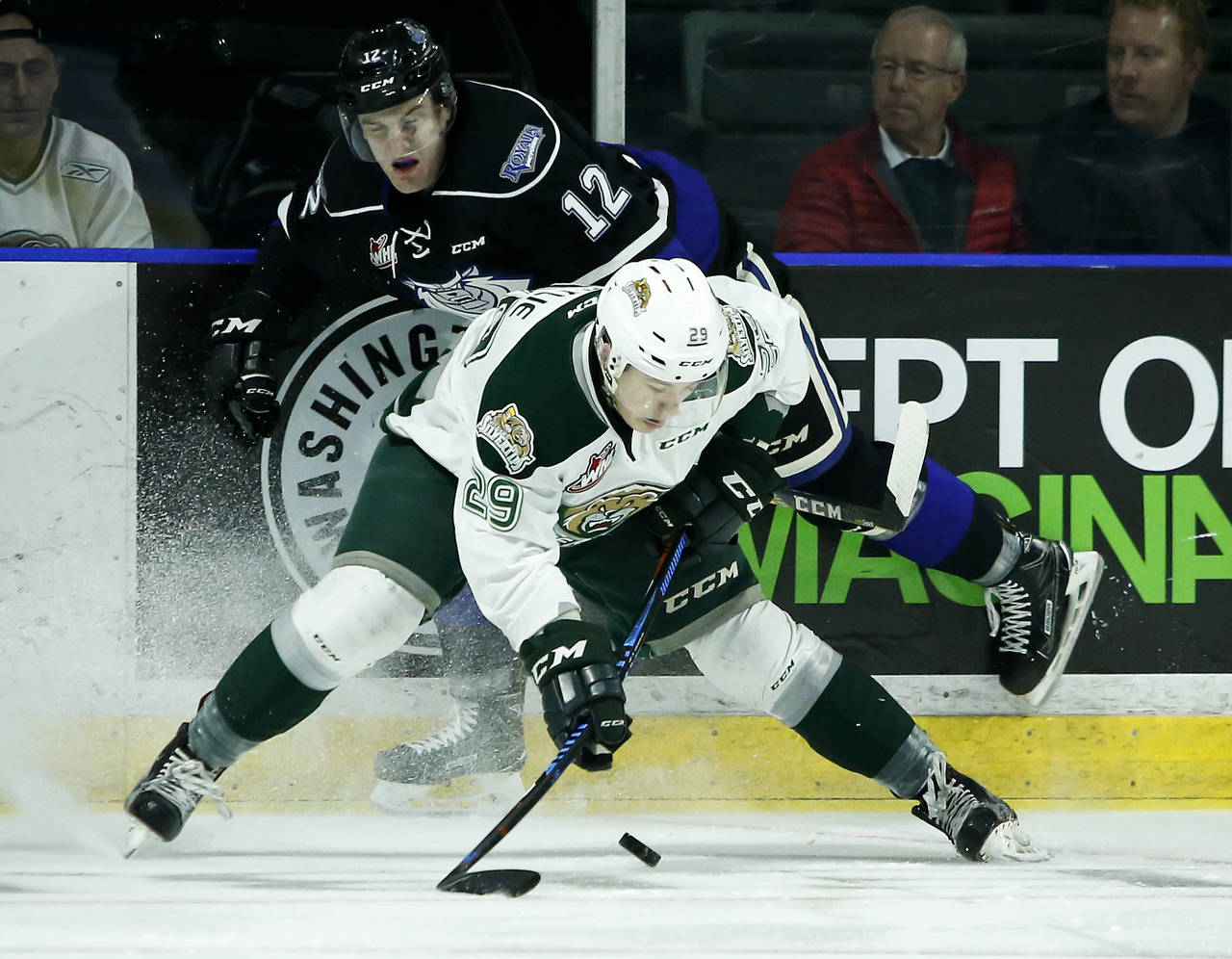 Victoria’s Spencer Gerth (top) collides with Everett’s Wyatte Wylie during a first-round WHL playoff game last March. Gerth, who started his WHL career with the Silvertips, was traded back to Everett last week. (Ian Terry / The Herald)