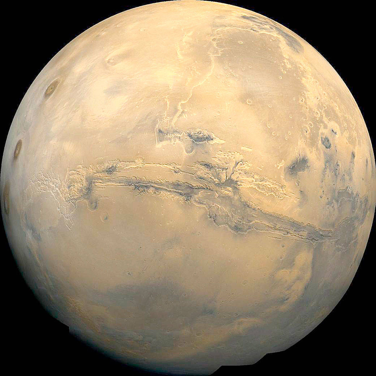 Planetary scientists say a new analysis of data shows that thick ice sheets hide just below parts of the surface of Mars. (NASA)