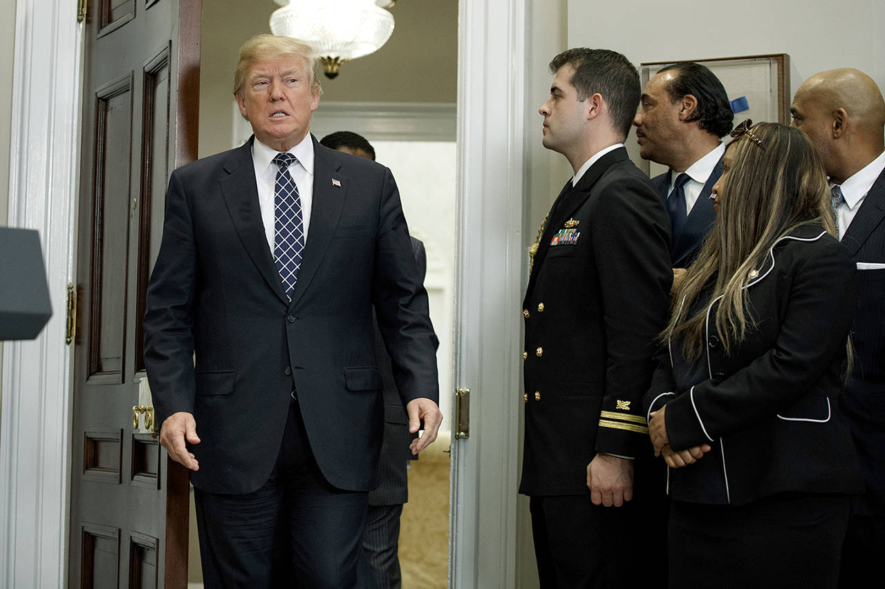 President Donald Trump arrives to an event to honor Dr. Martin Luther King Jr. in the Roosevelt Room of the White House on Friday. (AP Photo/Evan Vucci)