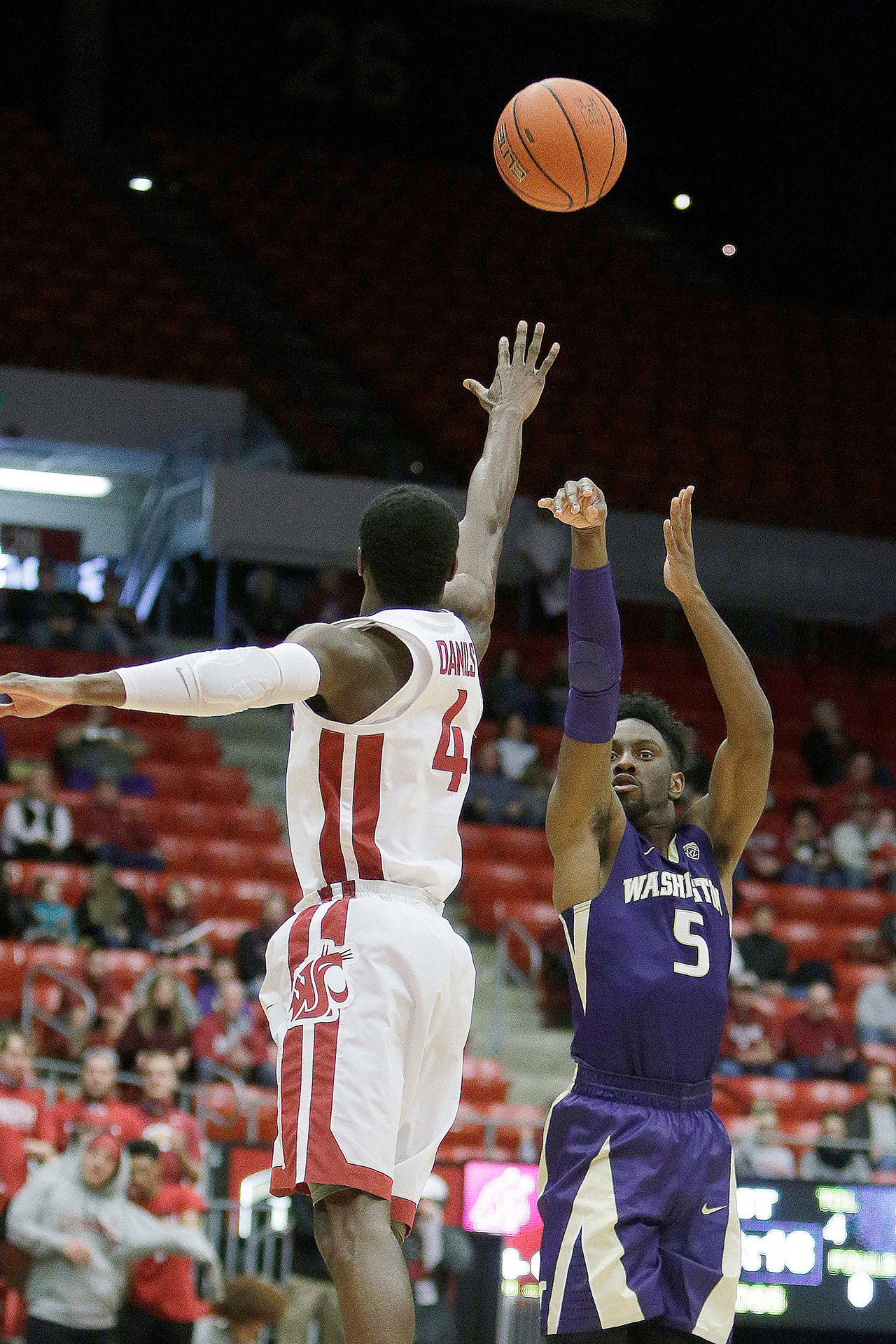 Washington’s Jaylen Nowell (5) shoots over Washington State’s Viont’e Daniels (4) during a win over the Cougars on Jan. 6 in Pullman. The Huskies’ 3-point shooting is still a question mark despite their 3-1 start to Pac-12 play. (AP Photo/Young Kwak)
