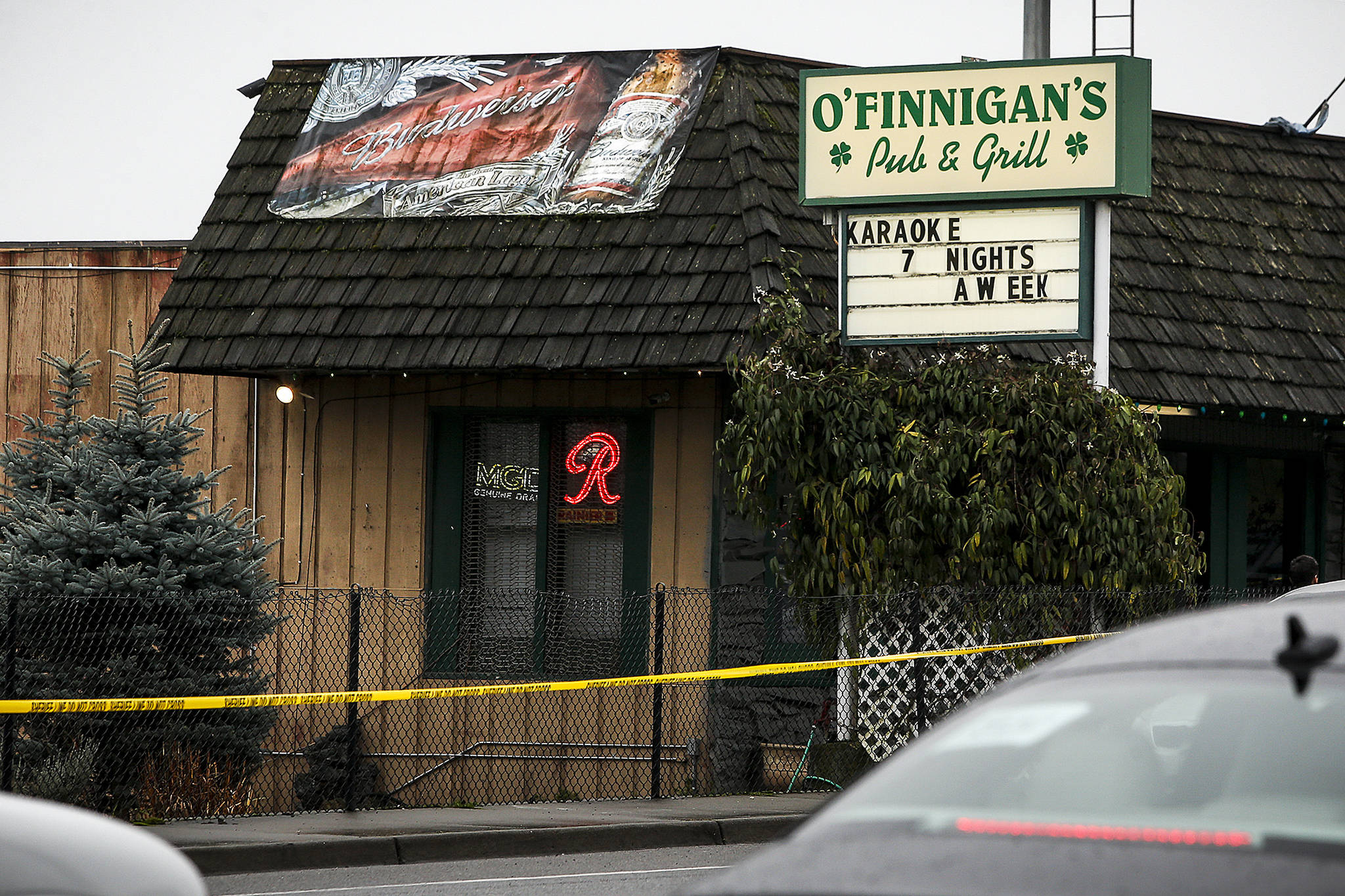 Police tape surrounds O’Finnigan’s Pub on Highway 99 south of Everett after a shooting there early on Saturday left one dead and one injured outside the bar. (Ian Terry / The Herald)
