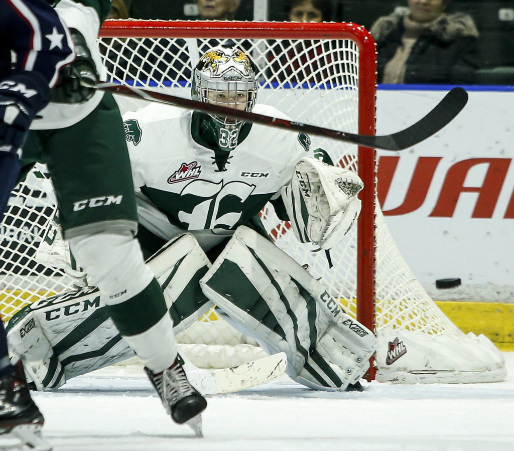 Silvertips goaltender Dustin Wolf eyes the puck during a game against the Tri-City Americans at Angels of the Winds Arena in Everett on Jan. 10. (Ian Terry / The Herald)
