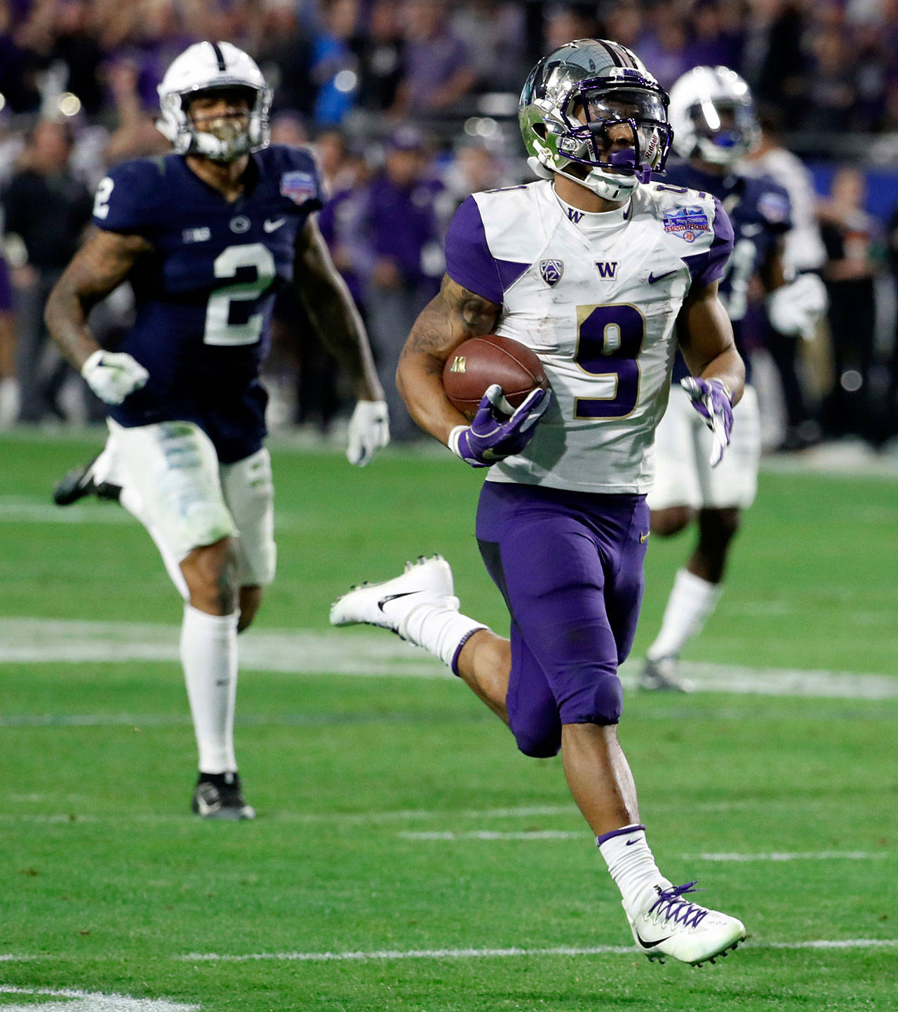 Washington’s Myles Gaskin (9) runs for a 69-yard touchdown against Penn State during the second half of the Fiesta Bowl on Dec. 30, 2017, in Glendale, Arizona. (AP Photo/Rick Scuteri)