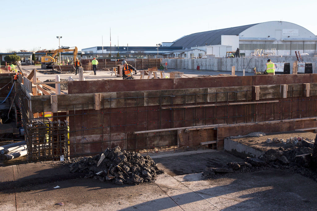 An area, under construction here on Dec. 7, will serve as a passenger terminal for Paine Field’s new commercial airport this fall. (Ian Terry / The Herald)
