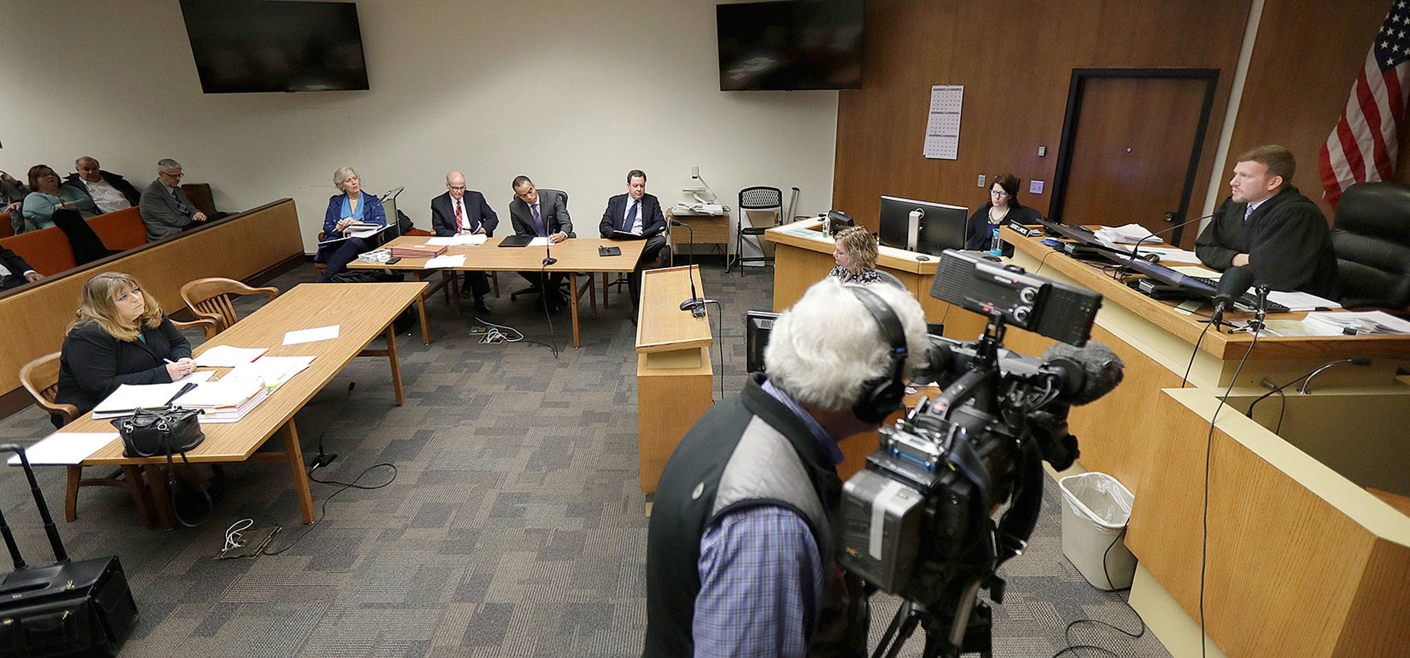 Thurston County Superior Court Judge Chris Lanese (right) speaks in court on Friday in Olympia. He ruled that the records of individual Washington state lawmakers are subject to public disclosure. (AP Photo/Ted S. Warren)