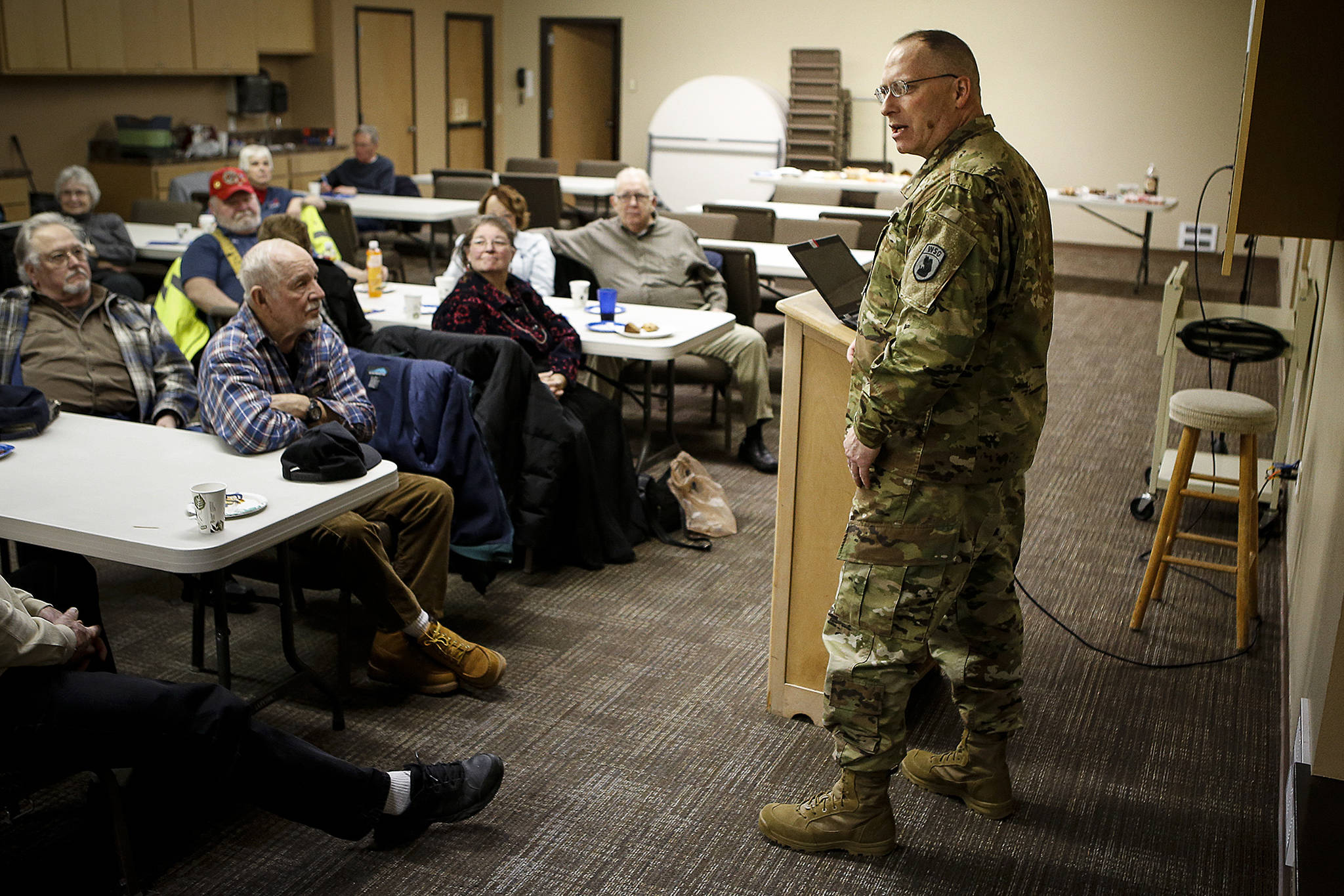 Washington State Guard Capt. and Chaplain Vance Whippo speaks to HIS veterans, a ministry at Camano Chapel, on Thursday. (Ian Terry / The Herald)