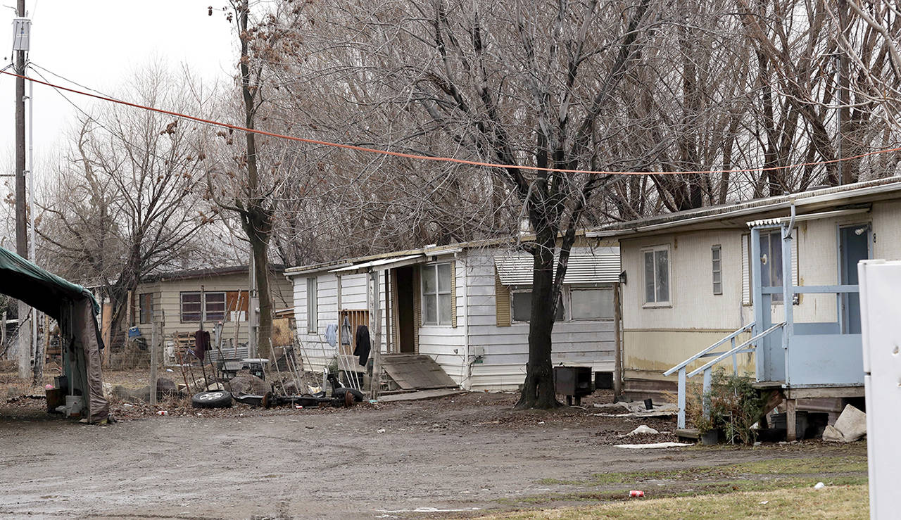 This Jan. 8 photo shows homes after people evacuated near the slow-moving Rattlesnake Ridge landslide in Union Gap. (AP Photo/Elaine Thompson)