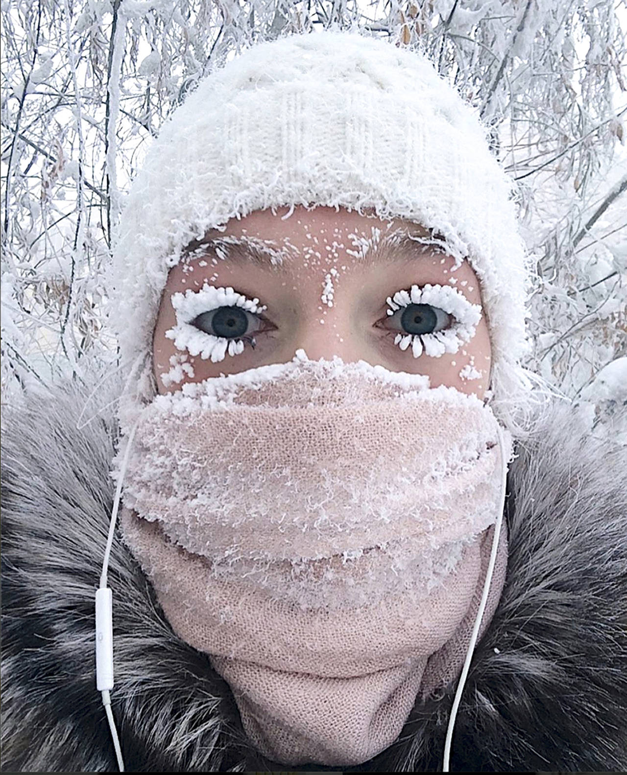 In this photo taken on Sunday, Anastasia Gruzdeva poses for selfie as the Temperature dropped to about -50 degrees (-58 degrees Fahrenheit) in Yakutsk, Russia. (sakhalife.ru photo via AP)