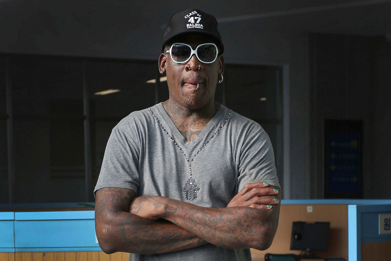 Former NBA basketball star Dennis Rodman listens to a guide at the Sci-Tech Complex in Pyongyang, North Korea, last summer. Rodman was arrested Saturday on suspicion of DUI in Southern California. (Kim Kwang Hyon / Associated Press file)