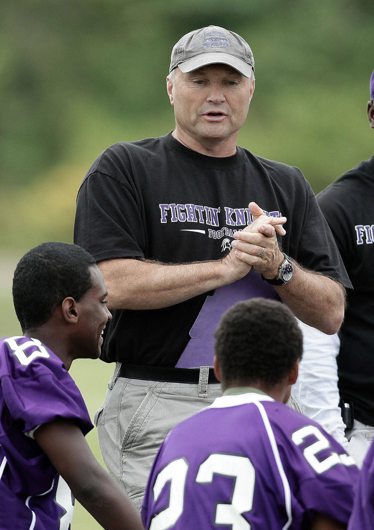 Kamiak football coach Dan Mack addresses his players prior to a passing-tournament game in the summer of 2010. (Jeff Faddis / For the Herald)