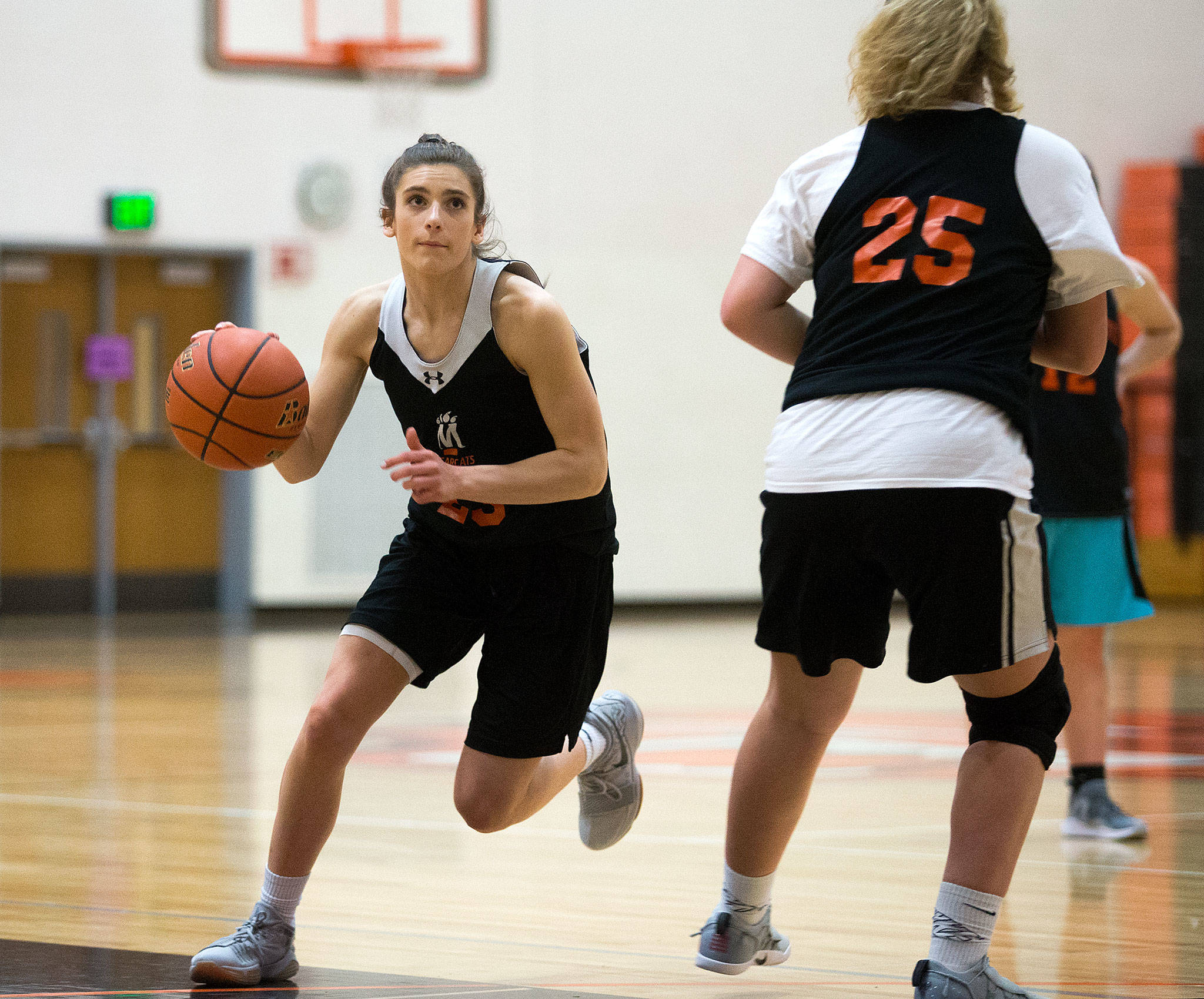 Monroe’s Monique Fierke drives to the basket at a Bearcats practice Jan. 18 in Monroe. Fierke is the Bearcats’ leading scorer. (Andy Bronson / The Herald)