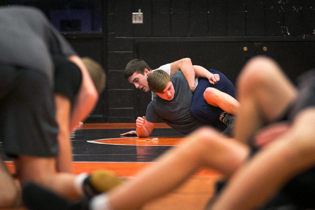 Monroe’s Paul Bischoff (left) wrestles Nathan Harrison during practice on Jan. 17, 2018, at Sky Valley Education Center in Monroe. (Kevin Clark / The Herald)
