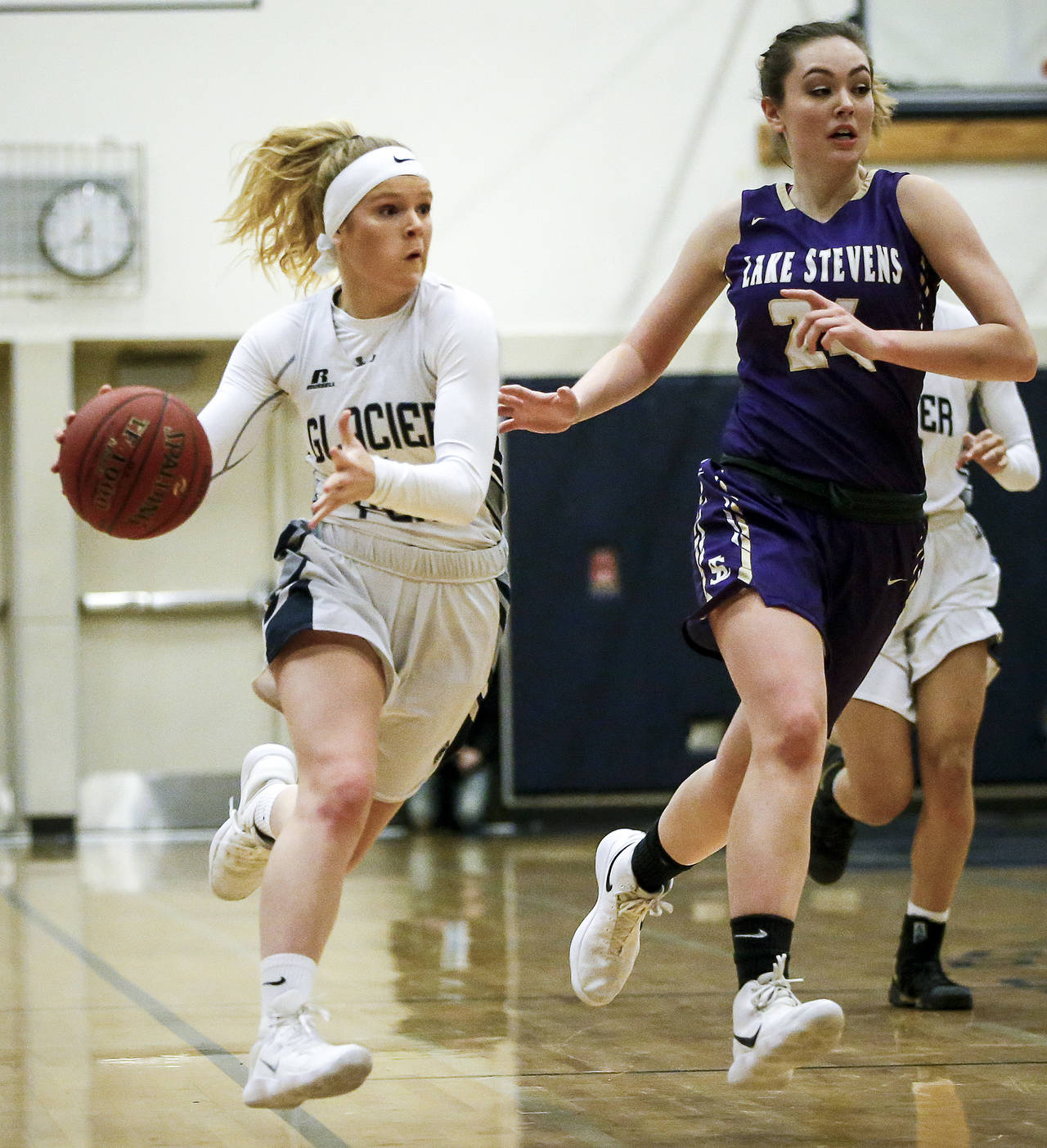 Glacier Peak’s Haley Grambo (left) dribbles down the court as Lake Stevens’ Anna Johanson defends during Friday’s game in Snohomish. (Ian Terry / The Herald)