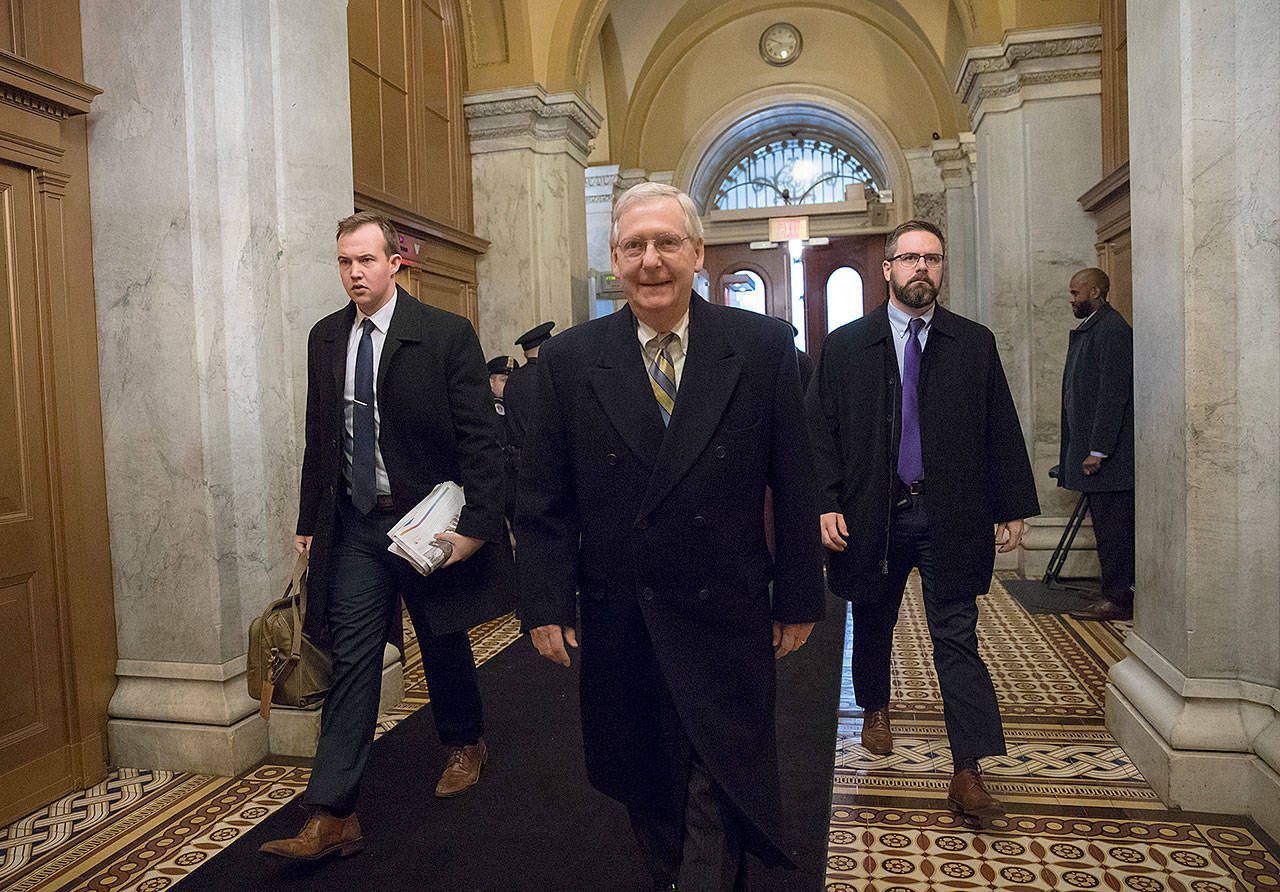 Senate Majority Leader Mitch McConnell, R-Ky., arrives at the Capitol on Friday as a bitterly divided Congress hurtled toward a government shutdown. (AP Photo/Scott Applewhite)