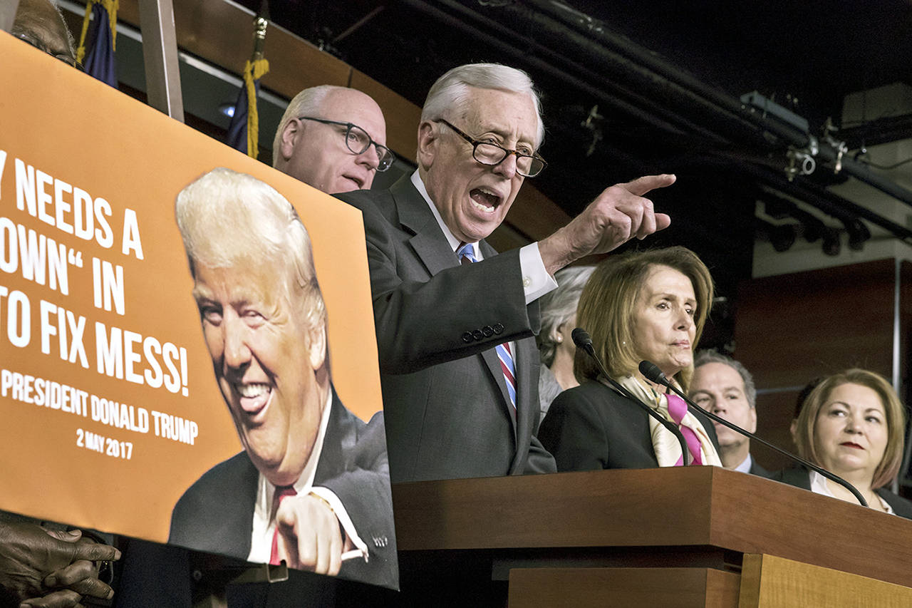 House Minority Whip Steny Hoyer, D-Md. (center), is joined by (from left) Rep. Joseph Crowley, D-N.Y., House Minority Leader Nancy Pelosi, D-Calif., and Rep. Linda Sanchez, D-Calif., at a news conference on the first morning of a government shutdown after a divided Senate rejected a funding measure last night, at the Capitol in Washington, on Saturday. (AP Photo/J. Scott Applewhite)